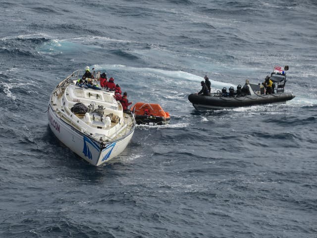 The type 45 destroyer HMS Dragon rescues 14 stricken sailors from a damaged British racing yacht