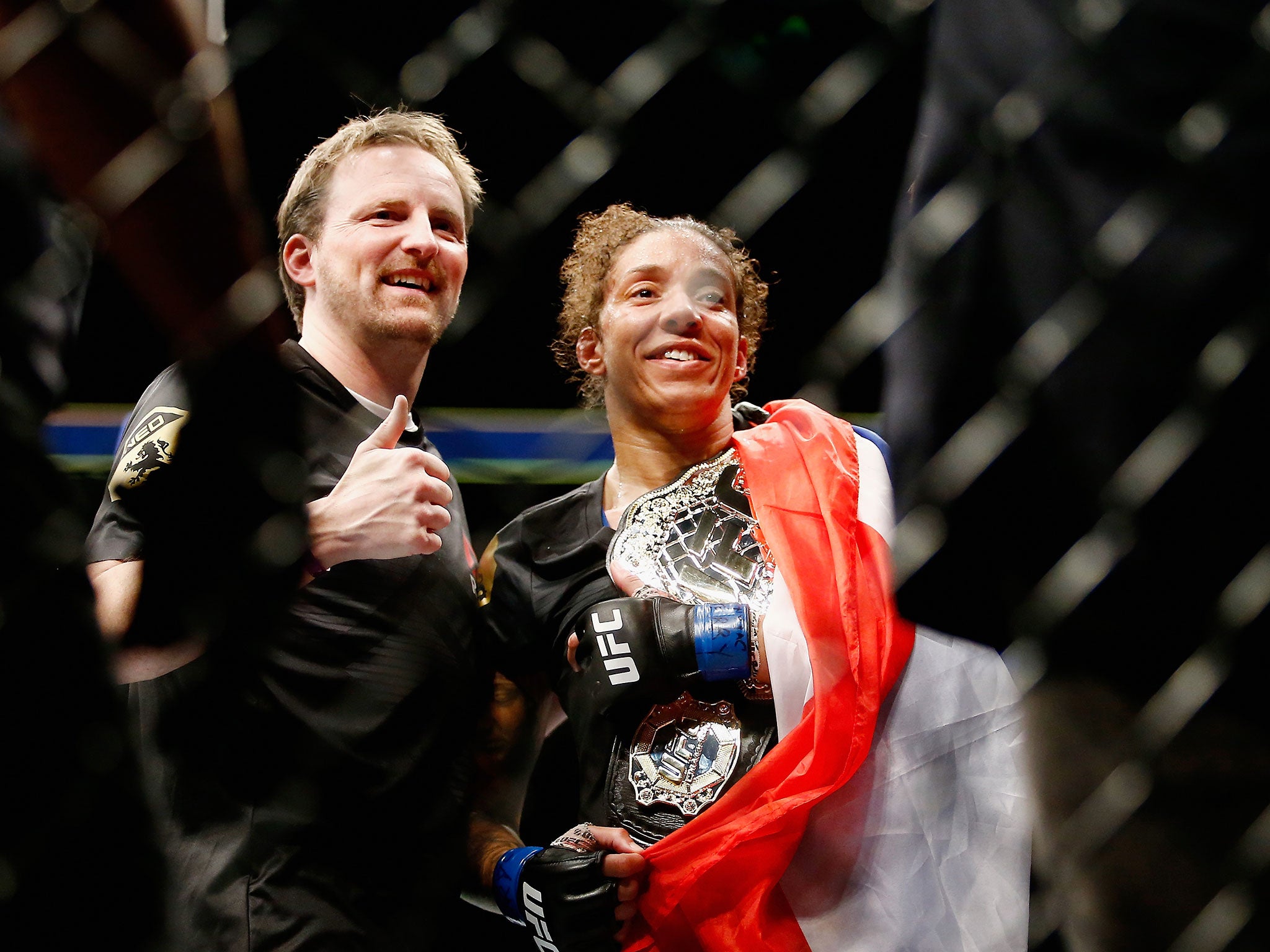 Germaine de Randamie of The Netherlands celebrates with the belt after defeating Holly Holm of United States in their UFC women's featherweight championship bout during UFC 208