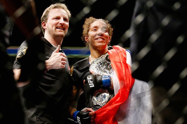 Germaine de Randamie of The Netherlands celebrates with the belt after defeating Holly Holm of United States in their UFC women's featherweight championship bout during UFC 208