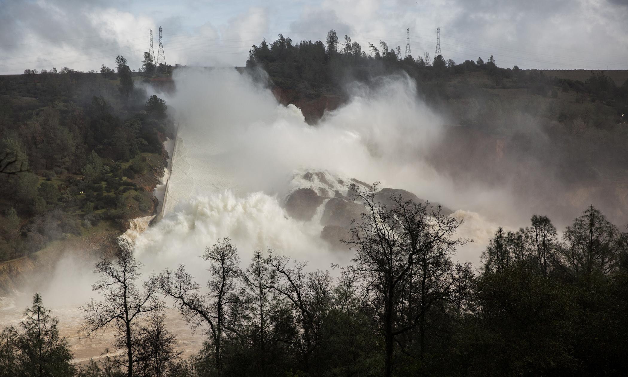 65,000 cfs of water flow through a damaged spillway on the Oroville Dam in Oroville, California, U.S., February 10, 2017.