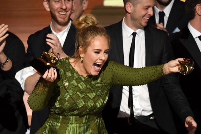 Adele snapped her Grammy in two, offering the other half to Beyoncé