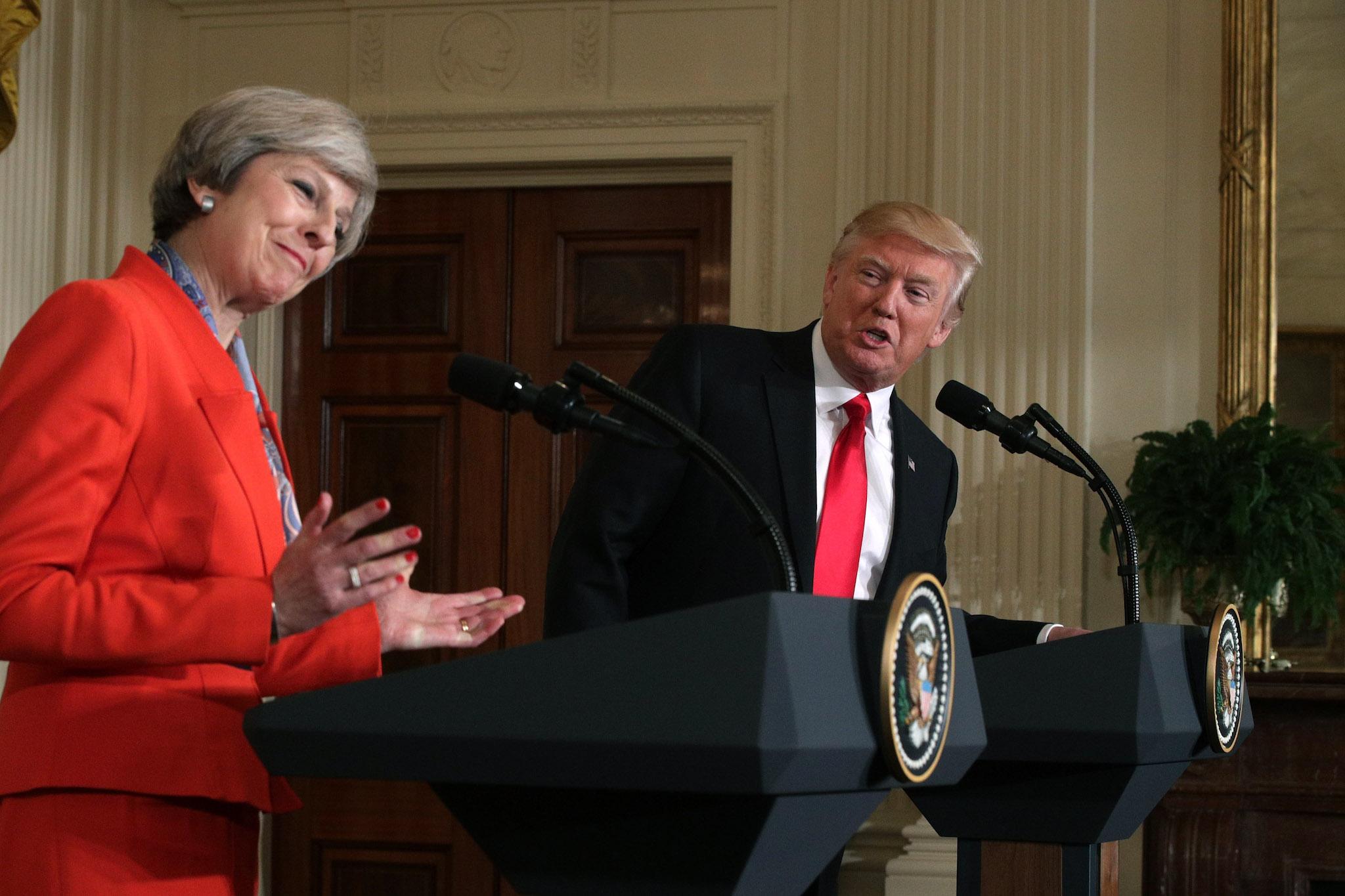 .S. President Donald Trump (R) and British Prime Minister Theresa May (L) participate in a joint press conference at the East Room of the White House January 27, 2017 in Washington, DC