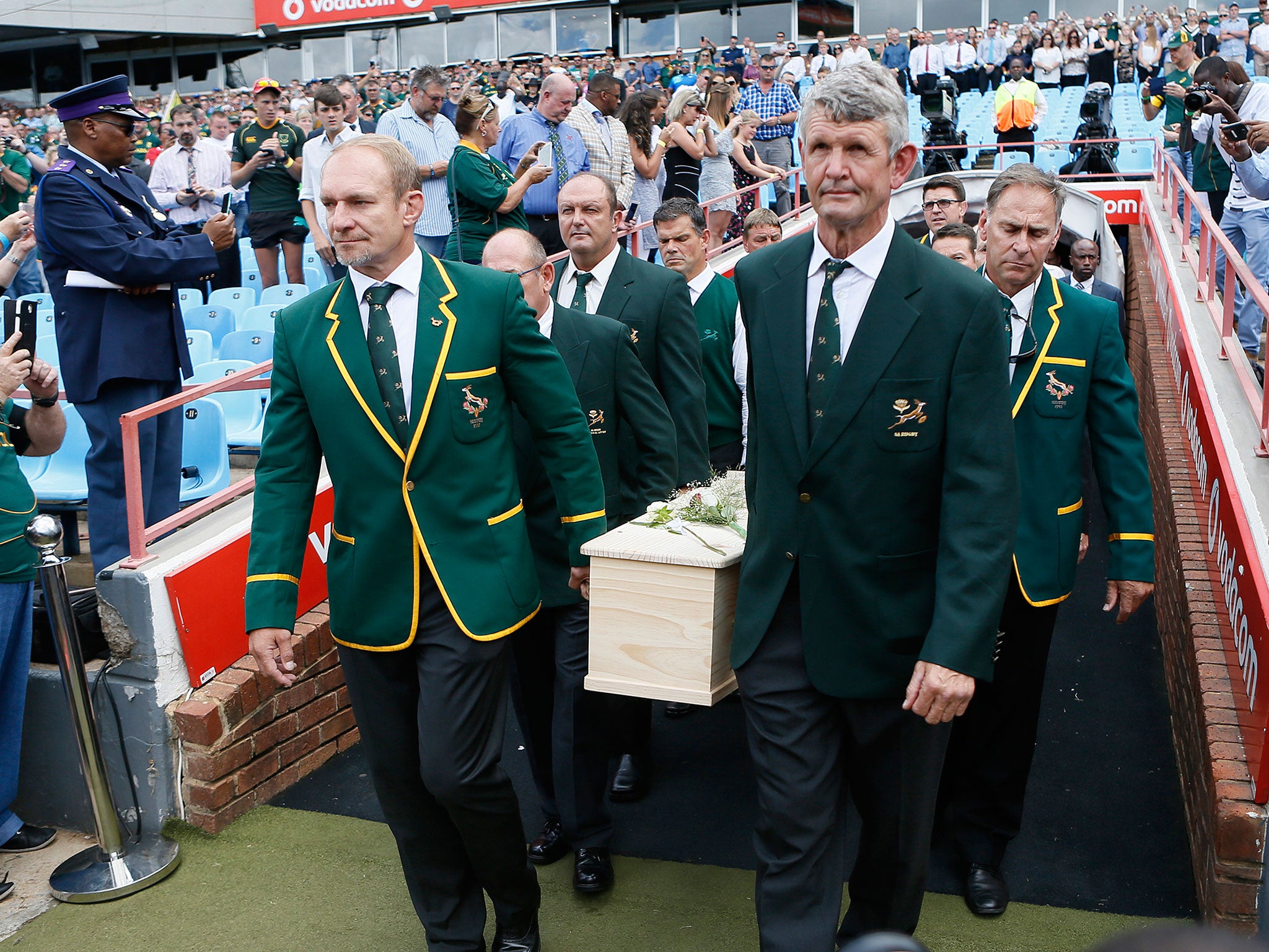 A number of former teammates, including World Cup-winning captain Francois Pienaar (left) carried Van der Westhuizen into the stadium