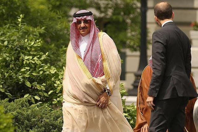 Crown Prince Mohammed bin Nayef is escorted as he arrives at the White House on May 13, 2015 in Washington, DC ahead of meetings with former President Barack Obama