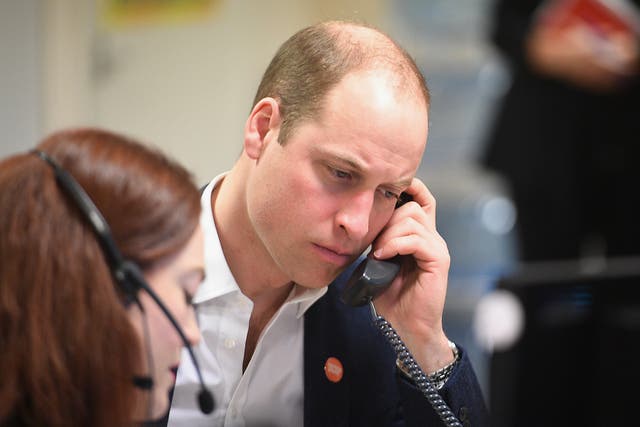 Prince William listens intently as adviser Carys Lewis takes the first call to the Centrepoint Helpline, after donations from Independent readers helped raise more than £3m to make the service a reality.