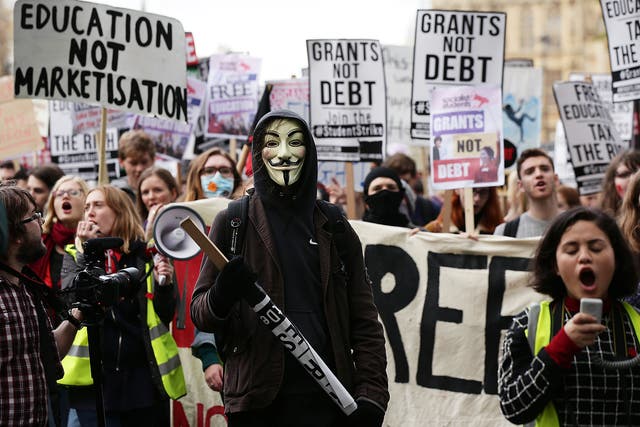 Students during a protest calling for the abolition of tuition fees and an end to student debt in Westminster, London.
