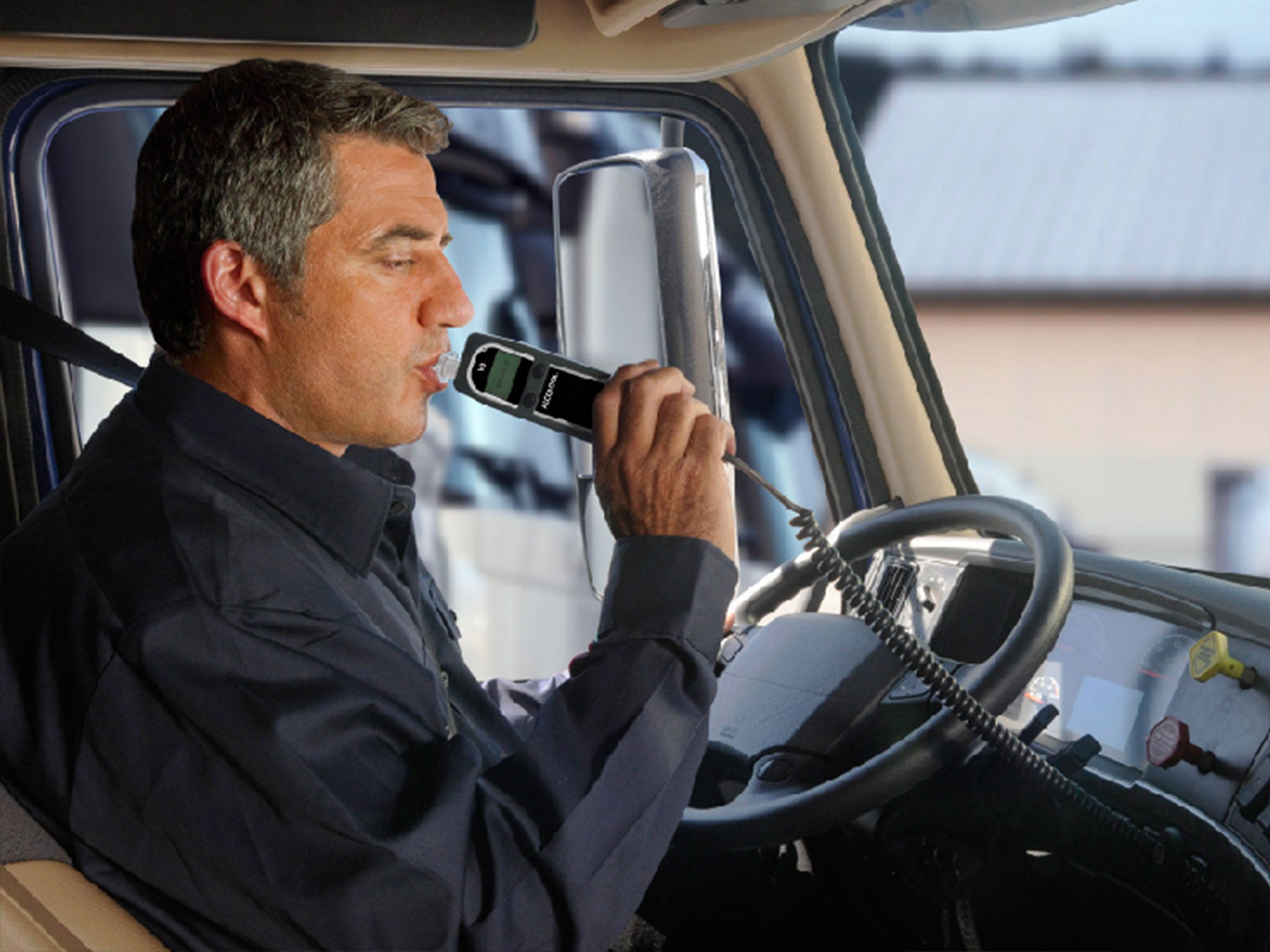 A man uses an in-car breathalyser, which is backed by an EU body