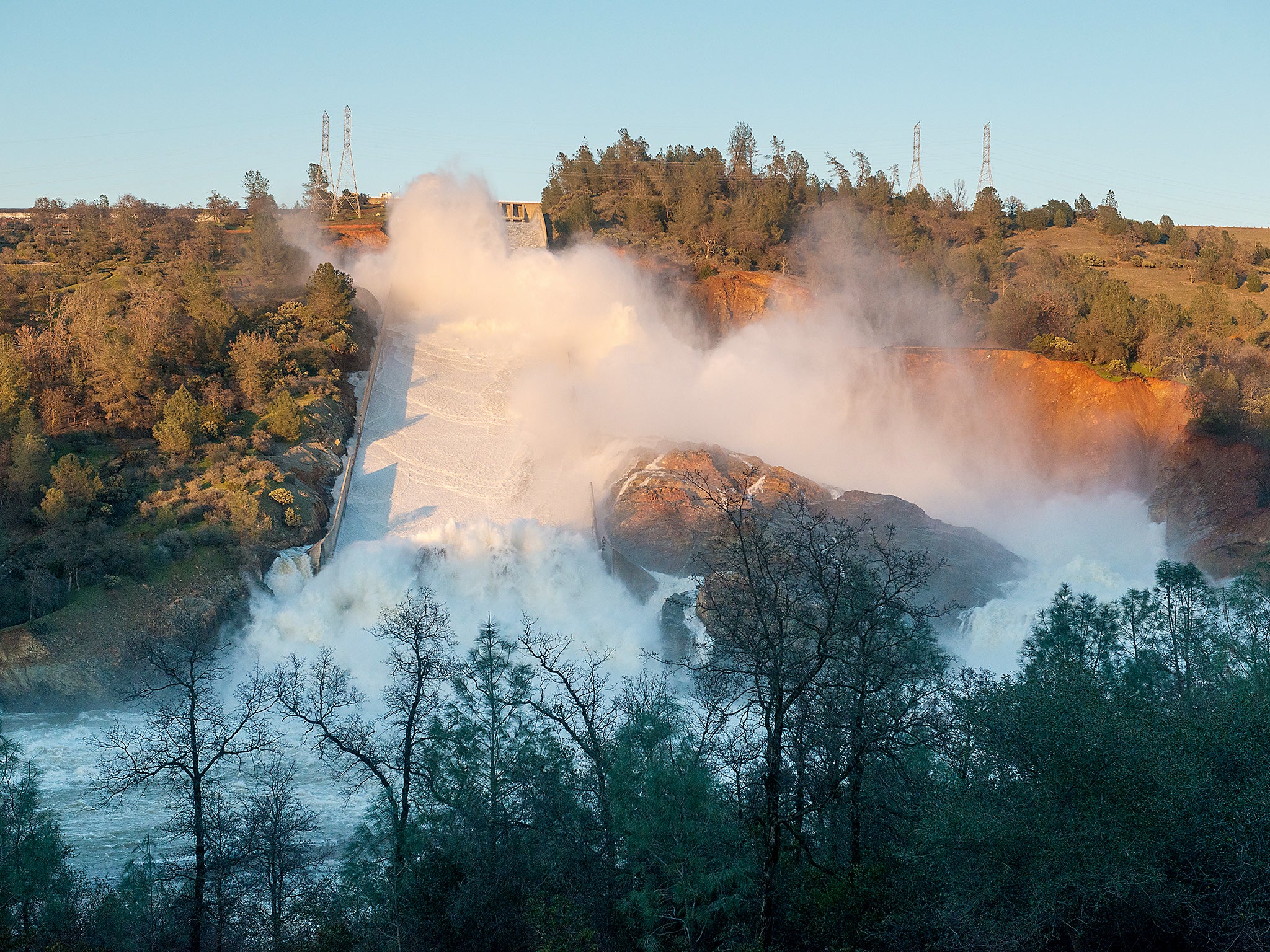 Water Resourses showing water cascading into the Feather River from the damaged Oroville Dam spillway in Butte County, USA
