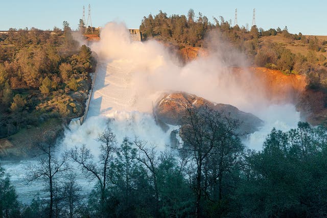 Water Resourses showing water cascading into the Feather River from the damaged Oroville Dam spillway in Butte County, USA