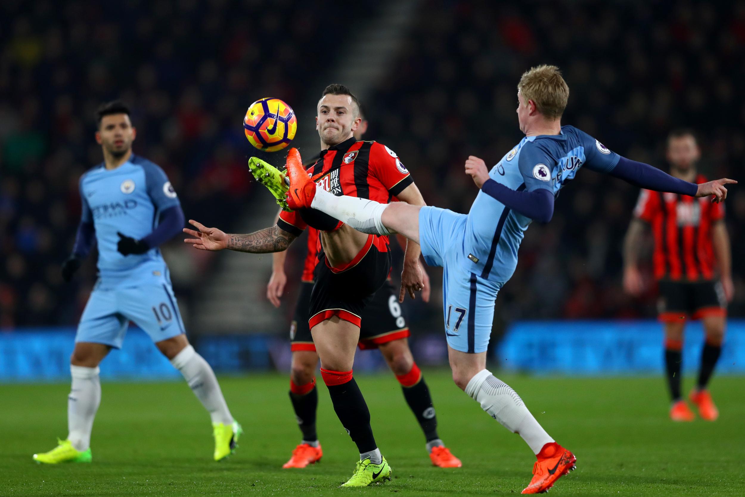 Kevin De Bruyne and Jack Wilshere vie for possession