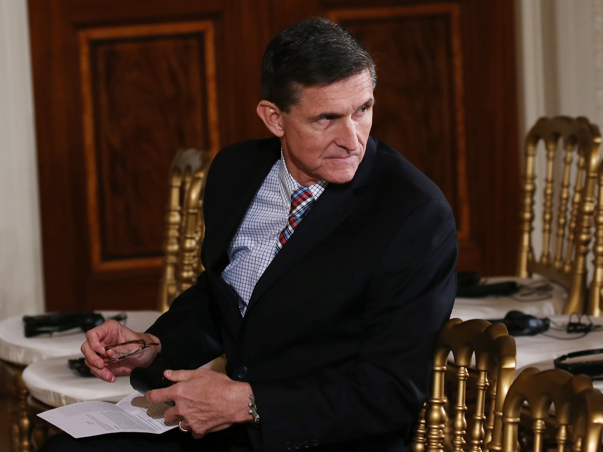 Michael Flynn, pictured in the East Room of the White House before a press conference, was pardoned on Wednesday