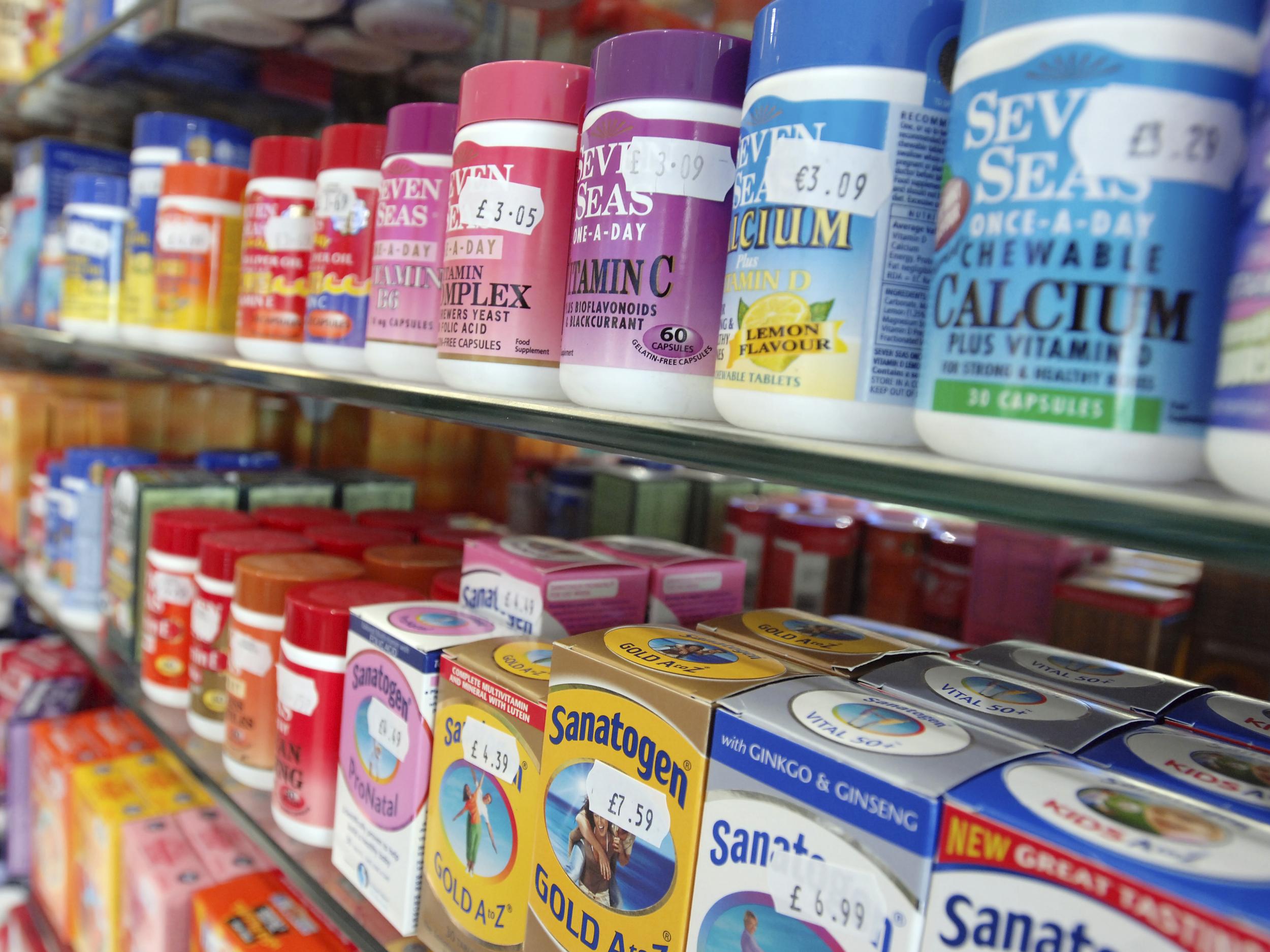 Packs of multivitamins and minerals on display at a chemist's