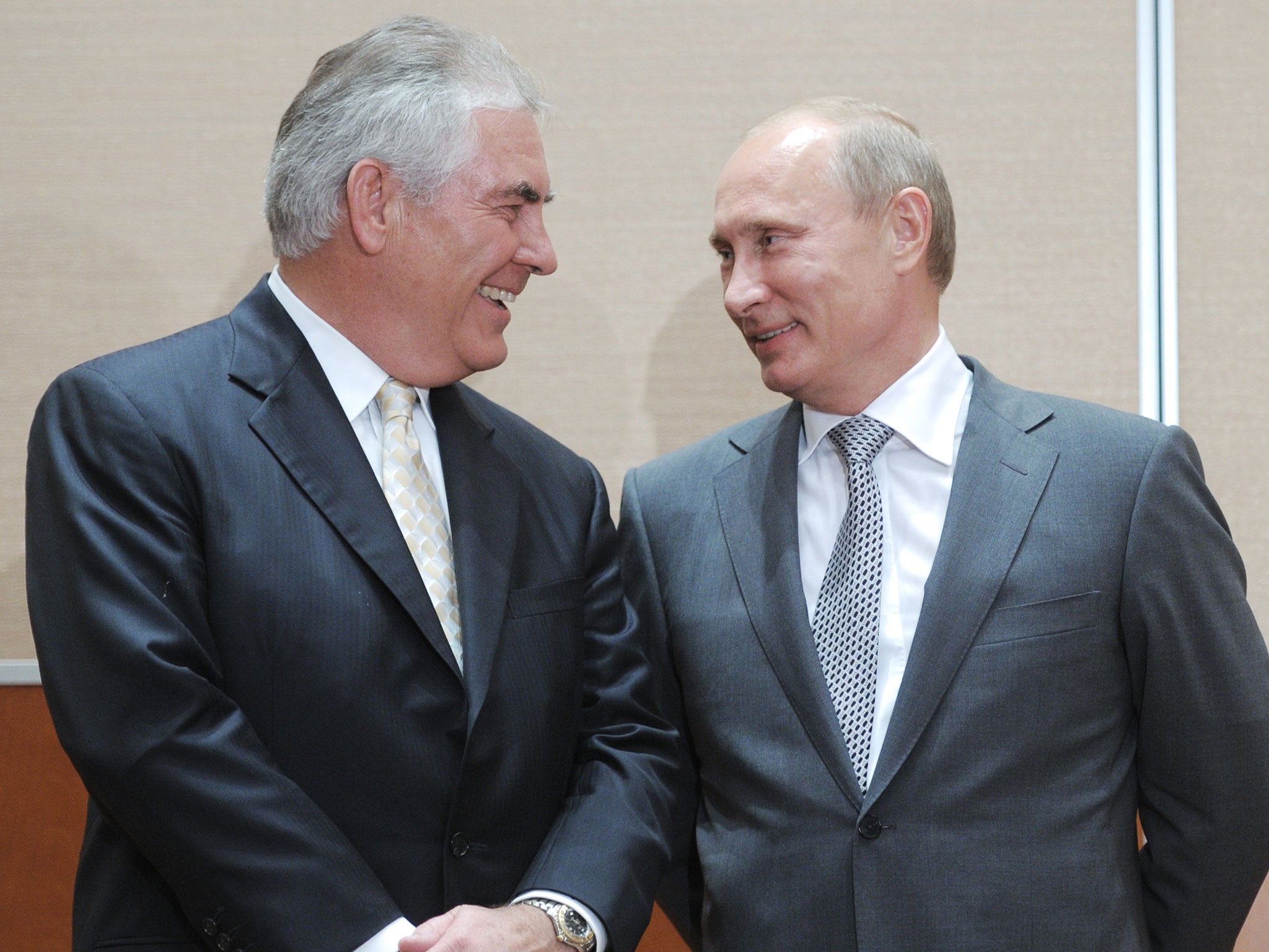 Vladimir Putin speaks with Rex Tillerson during the signing of a Rosneft-ExxonMobil strategic partnership agreement in Sochi in 2011.