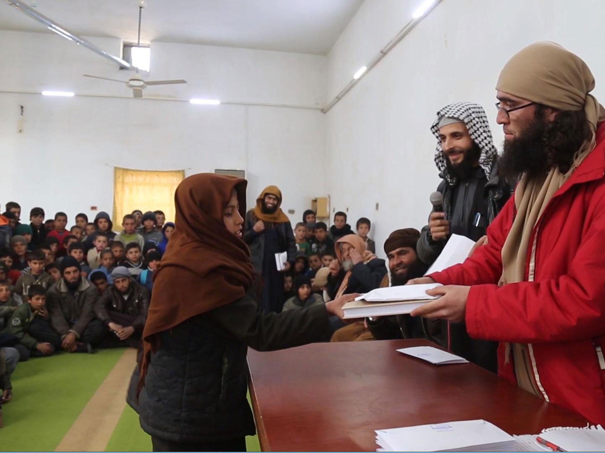 An Isis propaganda video released by Amaq agency on Sunday shows boys being rewarded by jihadis for memorising the Quran in Syria