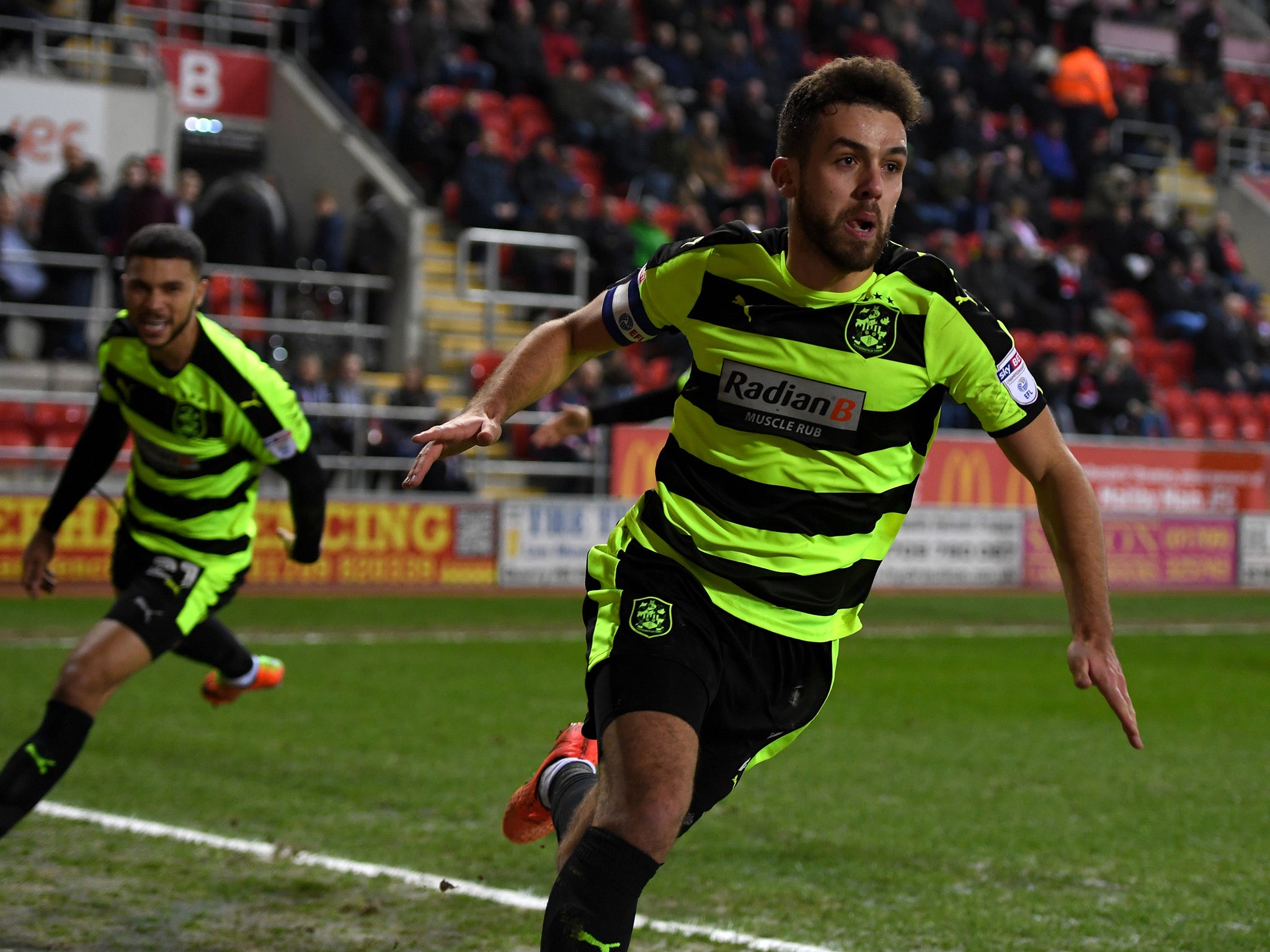 Tommy Smith wheels away after scoring Huddersfield's winner at Rotherham