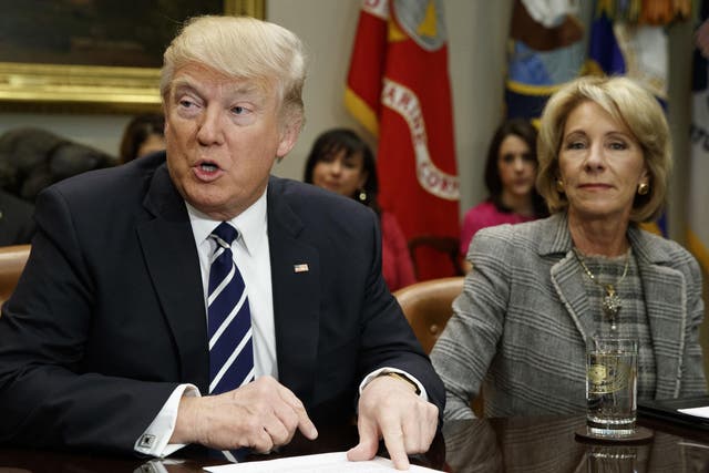 Donald Trump and Education Secretary Betsy DeVos at a White House meeting with parents and teachers