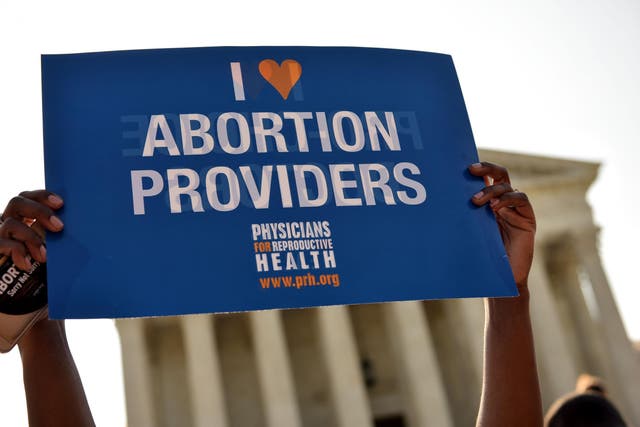 An abortion rights activist holds a placard outside the US Supreme Court last year after Whole Woman's Health helped overturn some of Texas' restrictive abortion laws