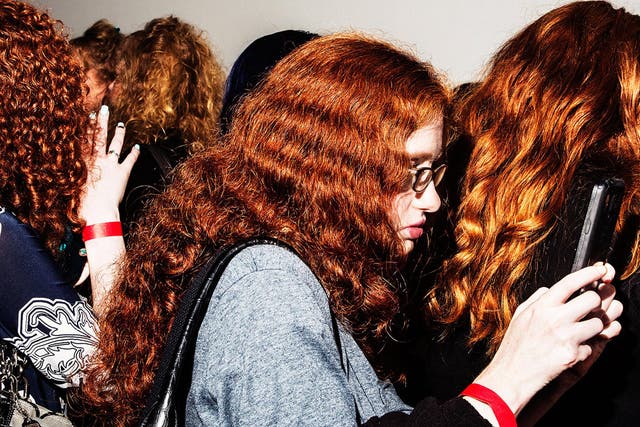 Photographer Amy Lombard has captured moments between communities, including people with red hair