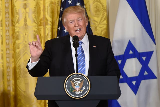 Trump speaks to reporters during a press conference with Israeli PM Netanyahu