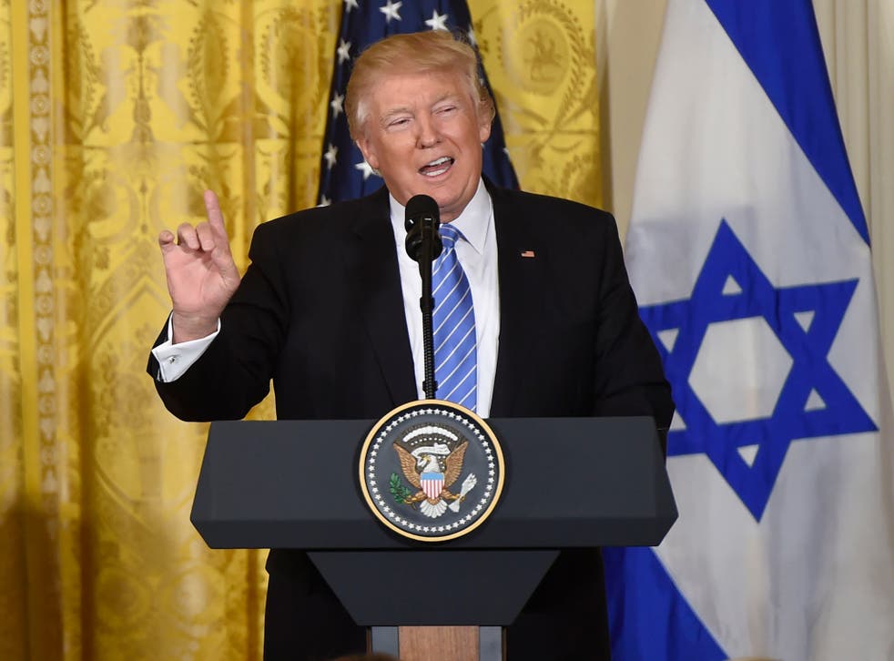 Trump speaks to reporters during a press conference with Israeli PM Netanyahu