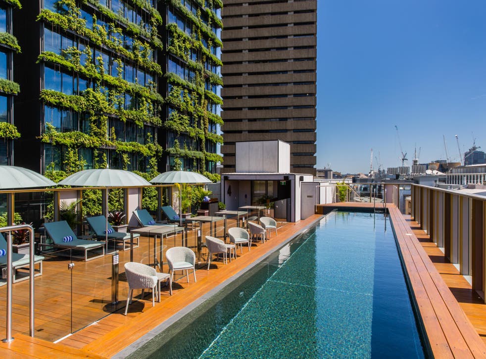 The rooftop pool is accompanied by an open-air bar
