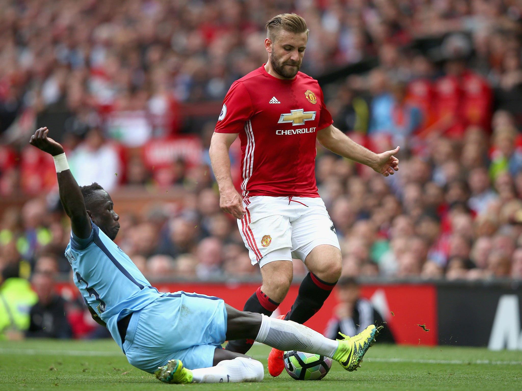 Shaw in action for United against rivals City in the first Manchester derby of the season