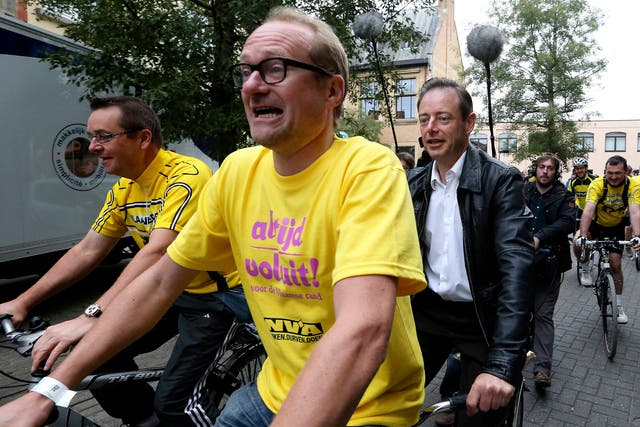 Mobility minister Ben Weyts (centre) was en route to a cycling event when his own bike was taken