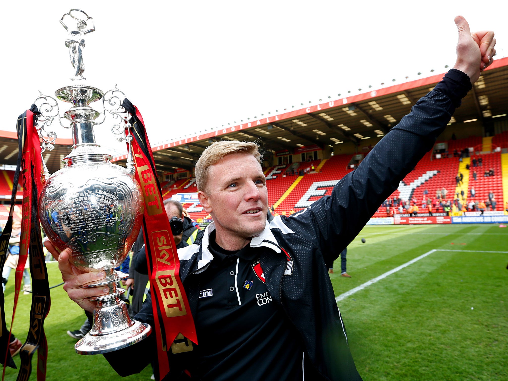 Howe celebrates after winning the Championship following a match between Bournemouth and Charlton in May 2015