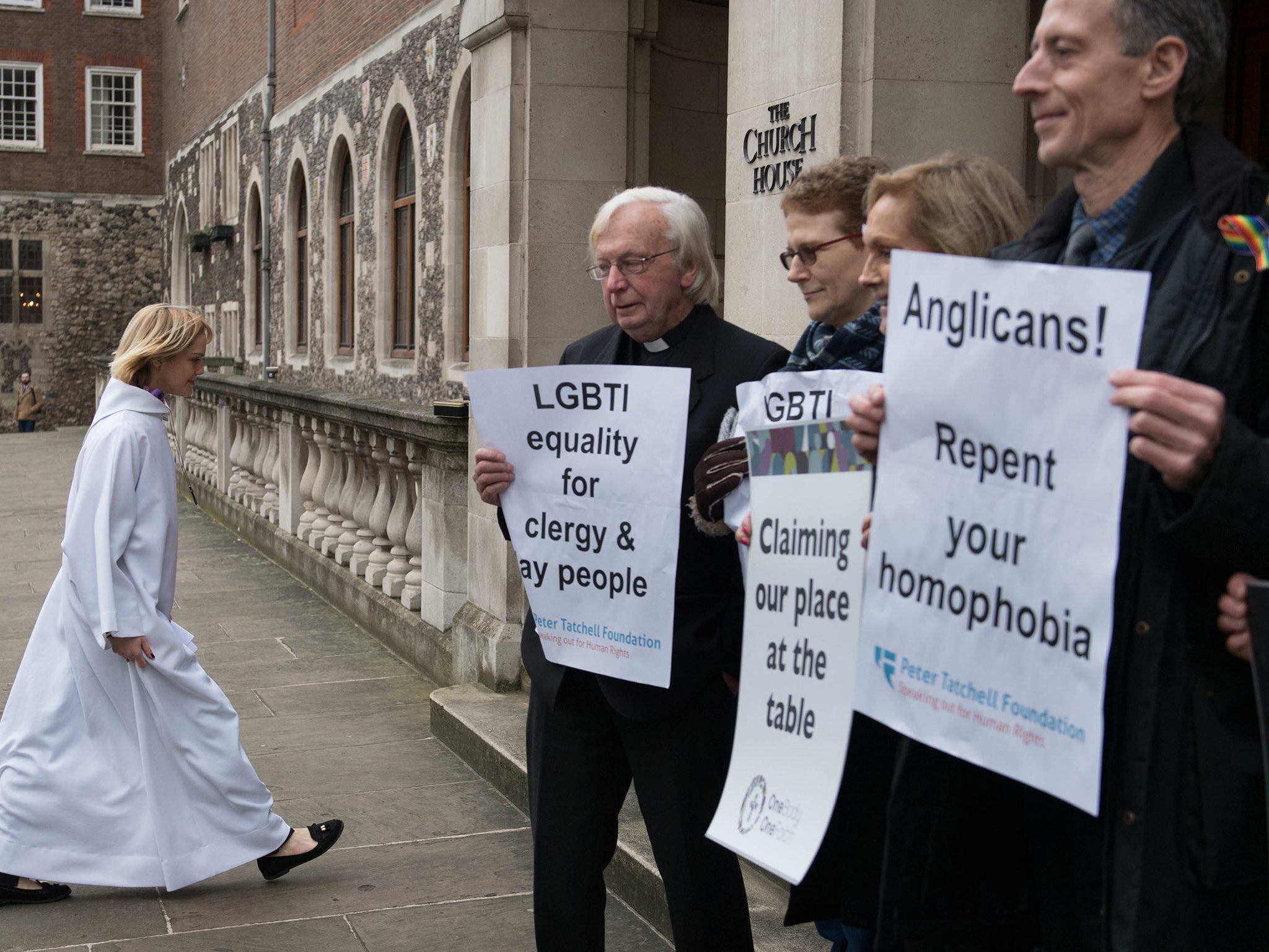 Activists from the Lesbian and Gay Christian Movement holding a vigil outside the General Synod to protest against the report (PA)