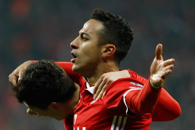 Thiago celebrates scoring Bayern's third goal of the night after Lewandowski's superb backheel