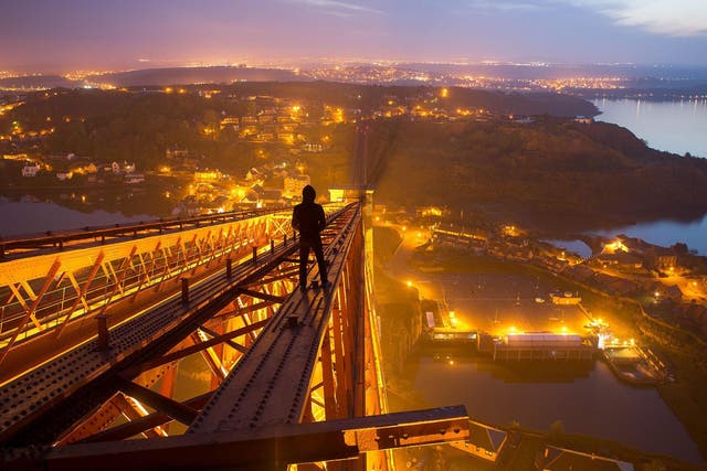 ‘Urban exploring is a calculated risk. When the risk/reward ratio is out of whack, you walk away from it. But the best explorations are right on that line’: urbexer Bradley Garrett surveys Edinburgh from atop the Forth Bridge