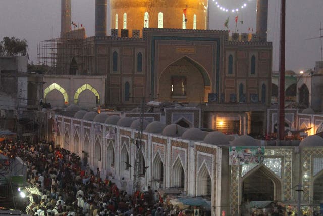 Pakistani devotees gather at the shrine of 13th century Sufi philosopher Lal Shahbaz Qalandar in Sehwan, in June 2014