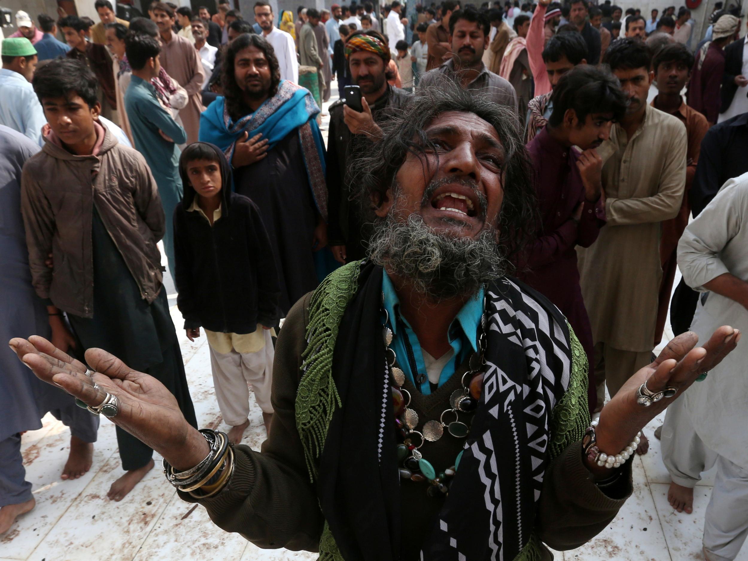 A man mourns the death of a relative killed in the suicide blast