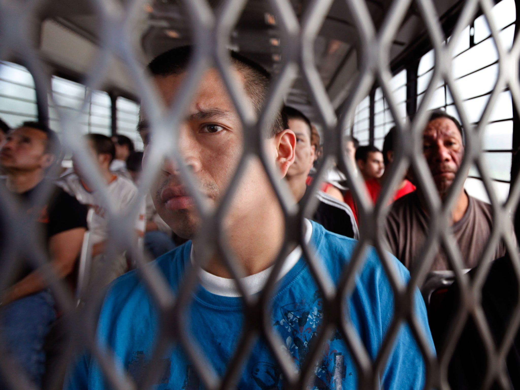 A group of undocumented immigrants being transported by ICE to airport for deportation