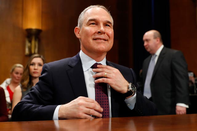 Pruitt arrives at his confirmation hearing before the Senate Committee on Environment and Public Works yesterday