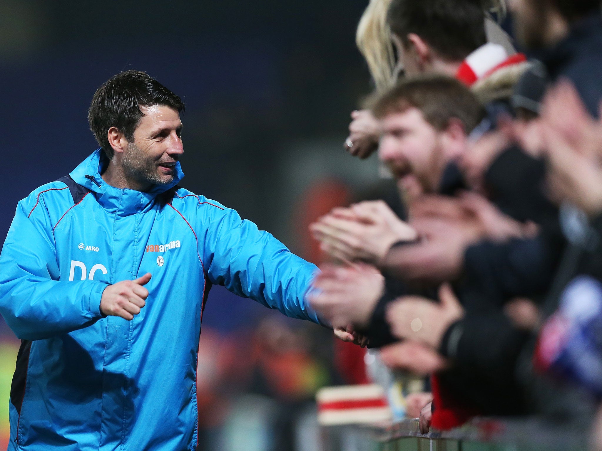 Danny Cowley with Lincoln fans after his side's FA Cup victory over Ipswich