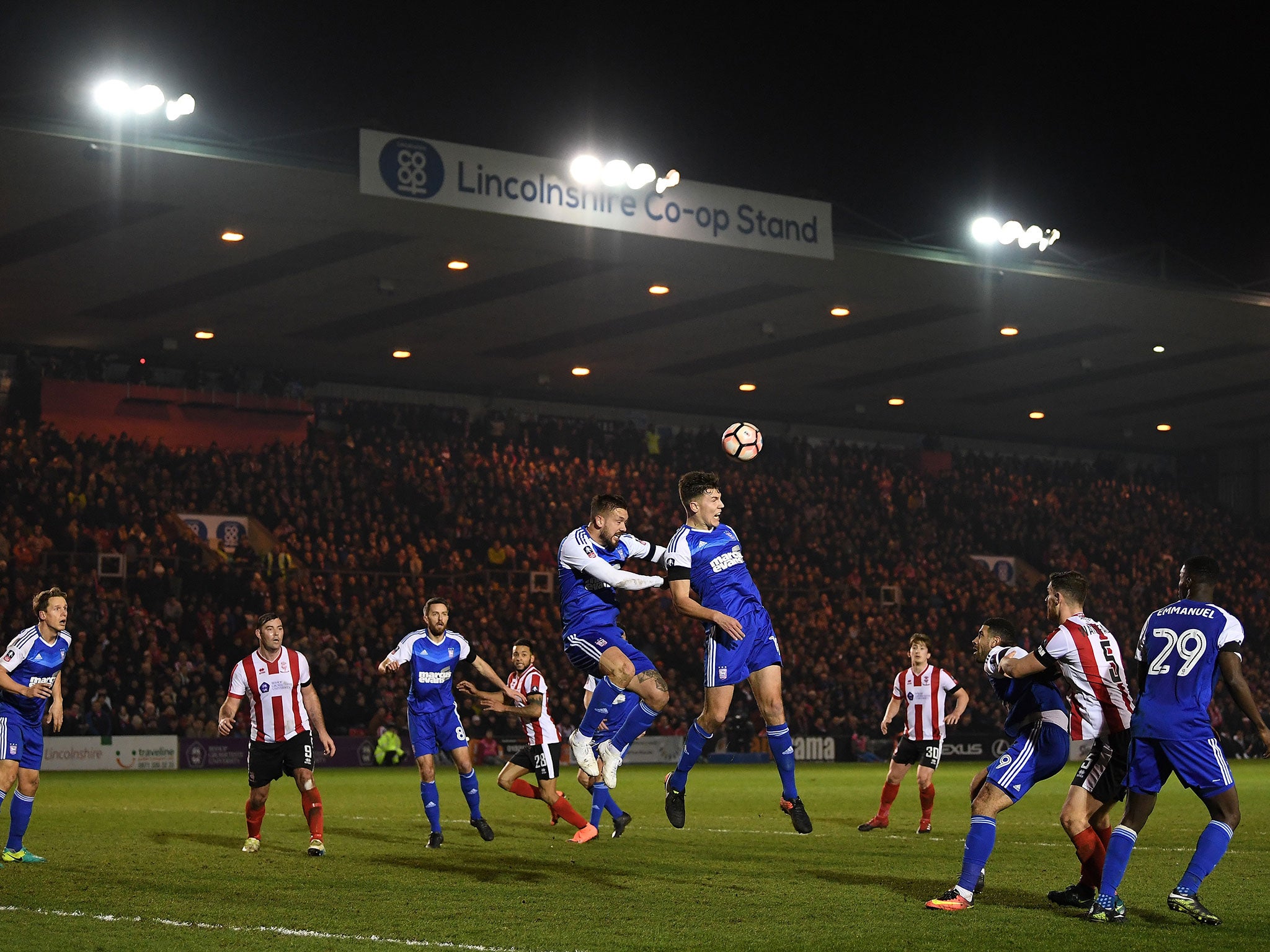 Lincoln in action against Ipswich Town during their FA Cup third round replay at the Sincil Bank Stadium