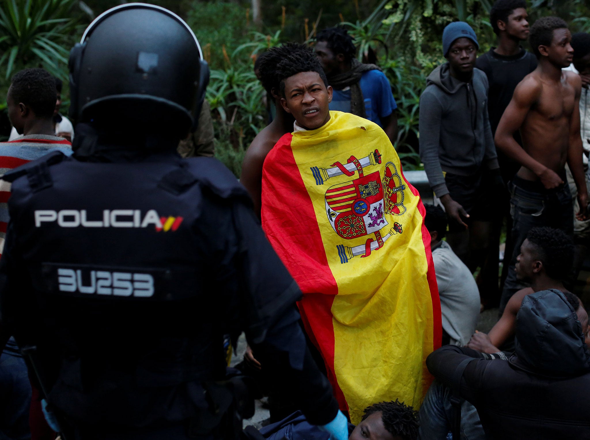 Migrants being held by police at the Ceti detention centre in Ceuta after crossing the border from Morocco to the Spanish enclave on 17 February