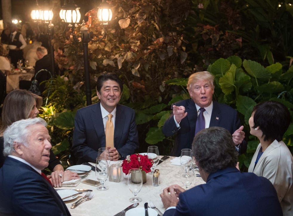 Donald Trump, with Japan Prime Minister Shinzo Abe, his wife, Melania Trump, and New England Patriots owner Robert Kraft, in Mar-a-Lago