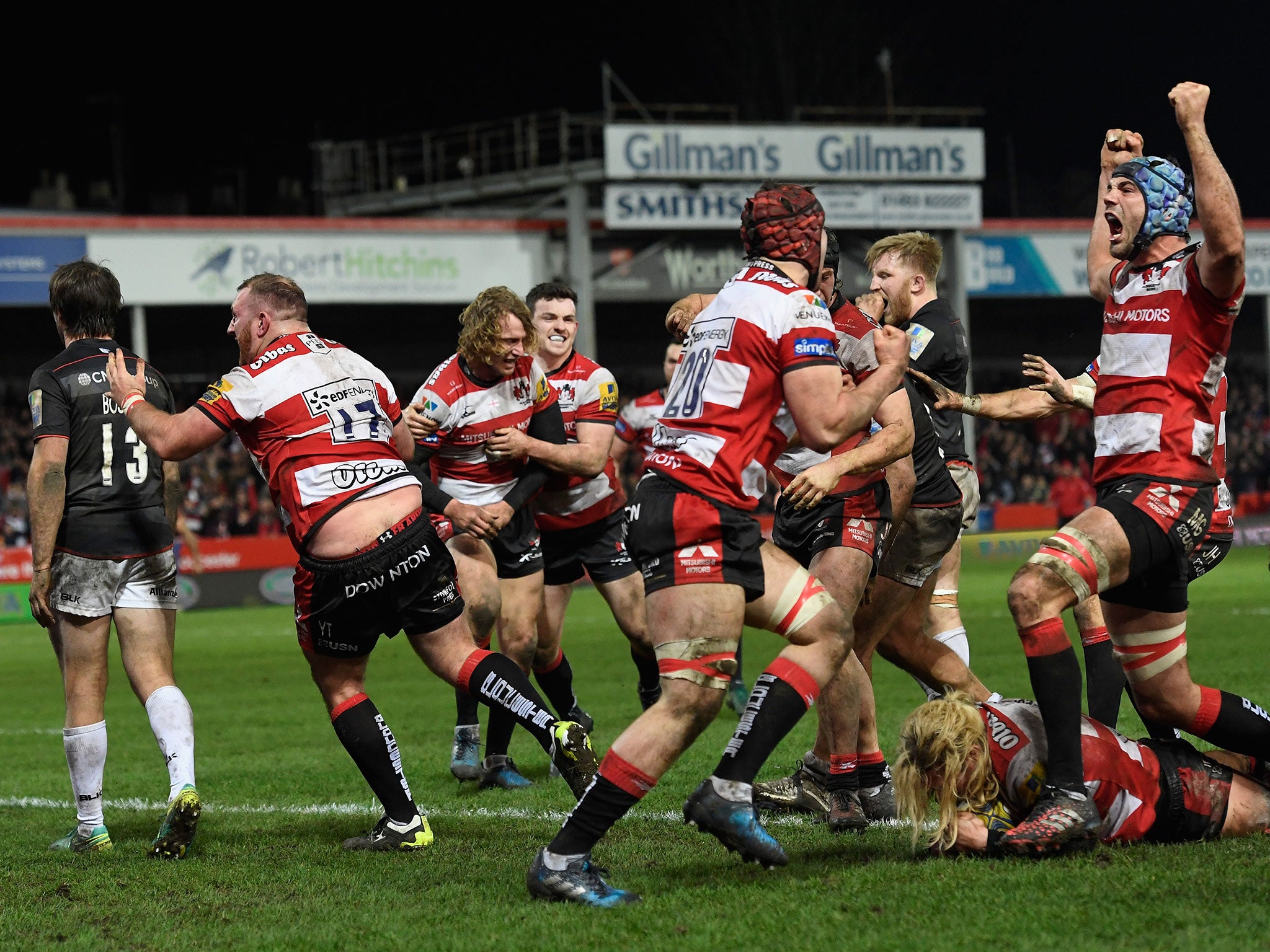 Gloucester's players celebrate after securing victory
