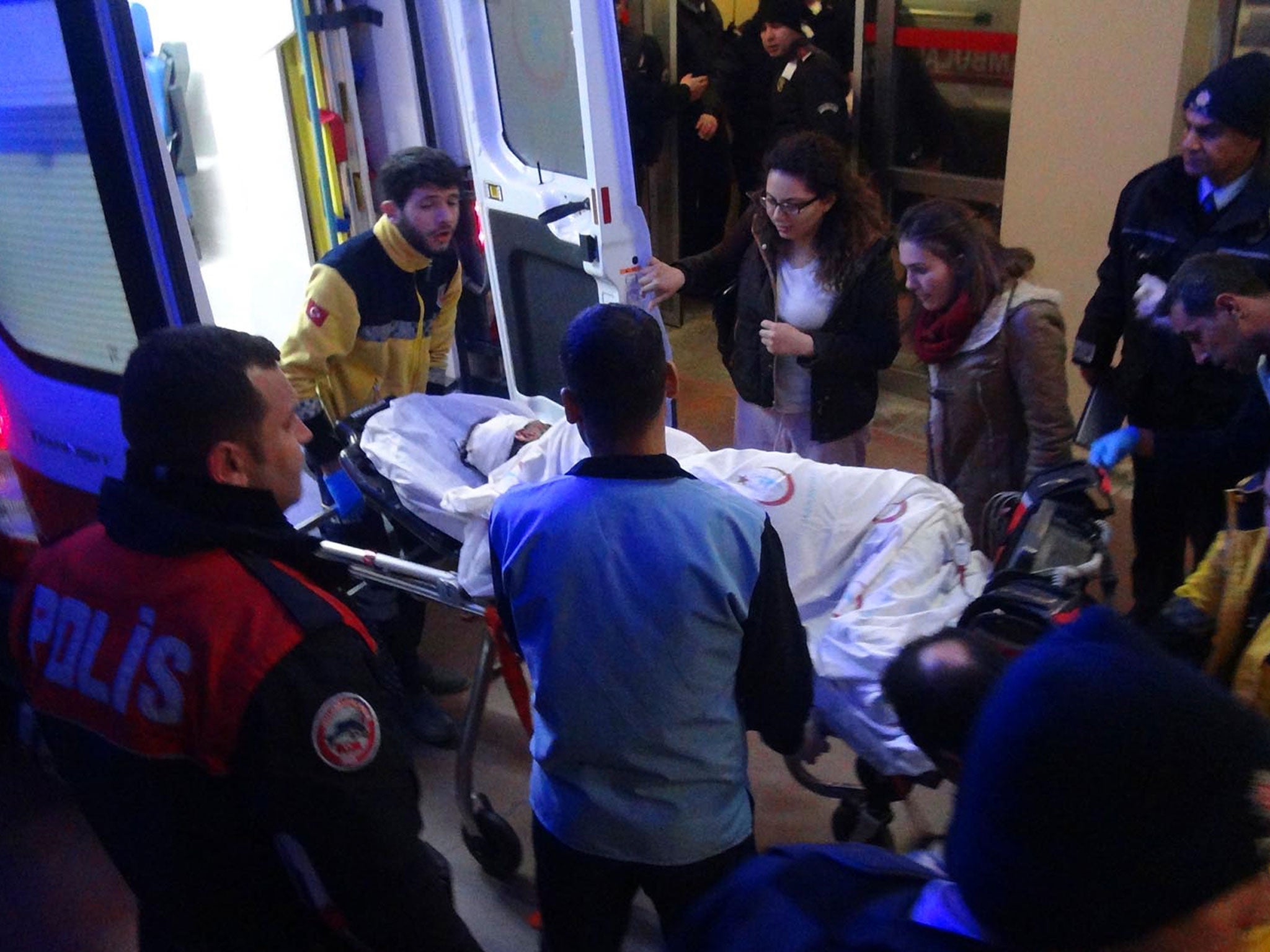 Paramedics carry a victim of a car bomb attack at a hospital in Viransehir