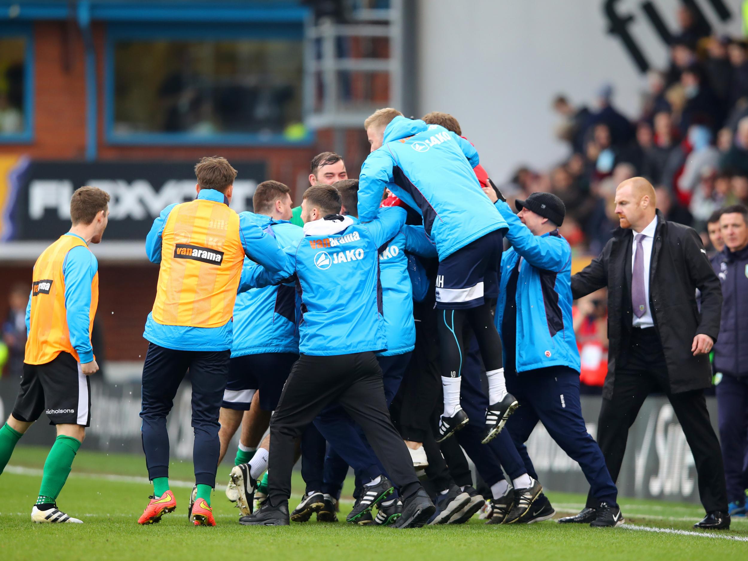 Lincoln's players celebrate their historic Cup win