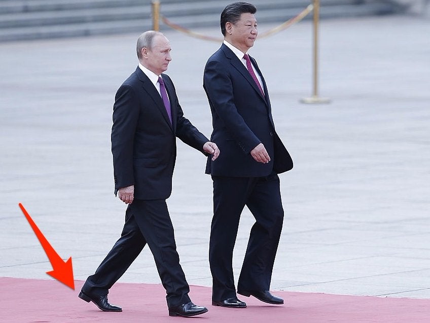 Vladimir Putin wearing shoes with a large heel