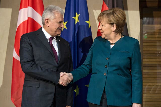 German Chancellor Angela Merkel with Turkish Prime Minister Binali Yildirim prior to a bilateral meeting during the 53rd Munich Security Conference on 18 February