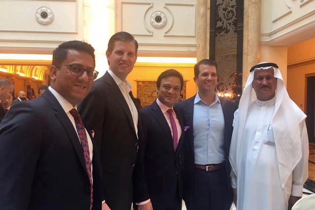 Banke International director Niraj Masand, far left, poses for a photo with Eric Trump, second left, Banke International director Porush Jhunjhunwala, center, Donald Trump Jr., second right, and DAMAC Properties chairman Hussain Sajwani, during festivities marking the formal opening of the Trump International Golf Club, in Dubai,