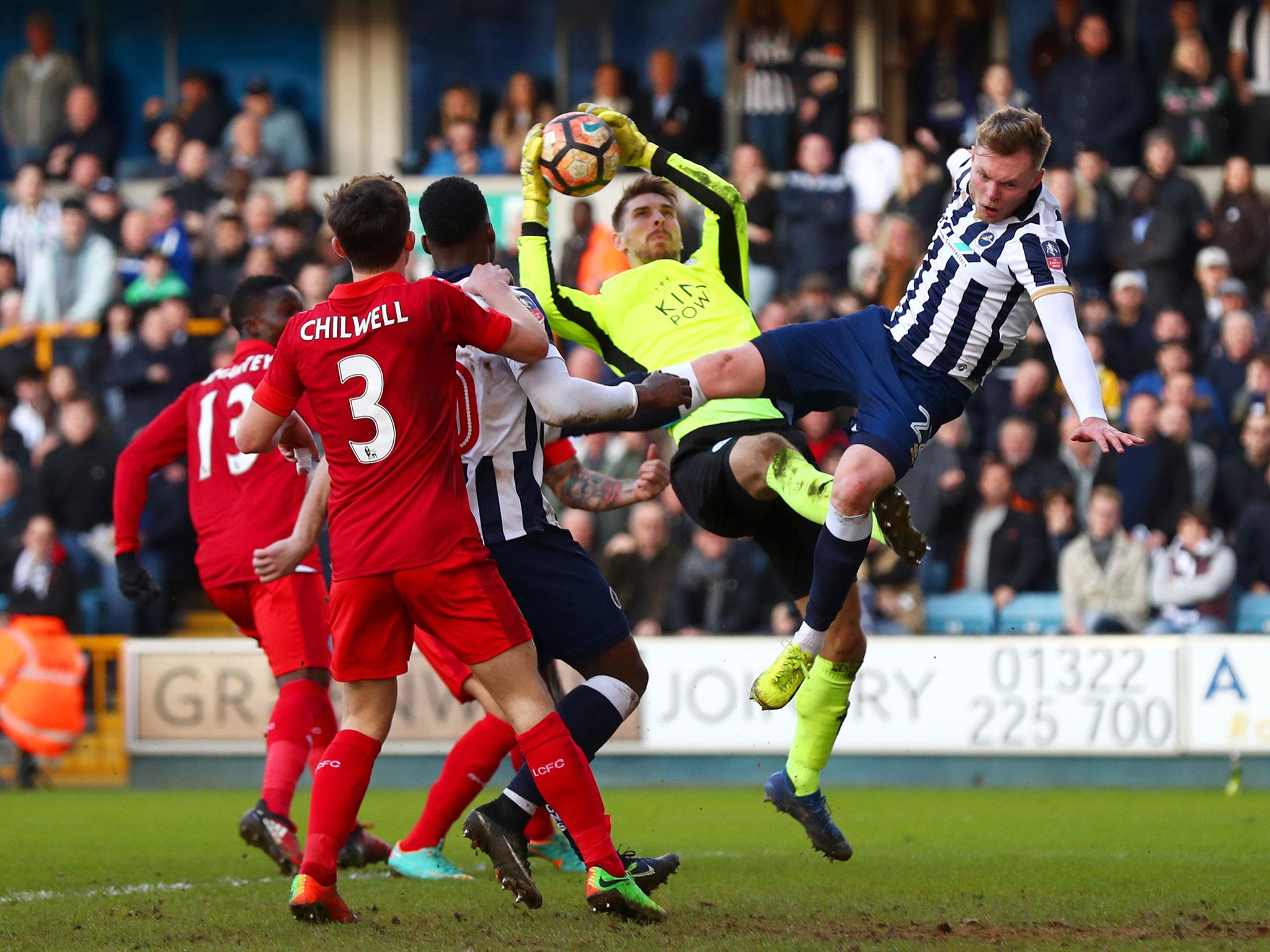 Ron-Robert Zieler of Leicester City collects the ball from Aiden O'Brien of Millwall