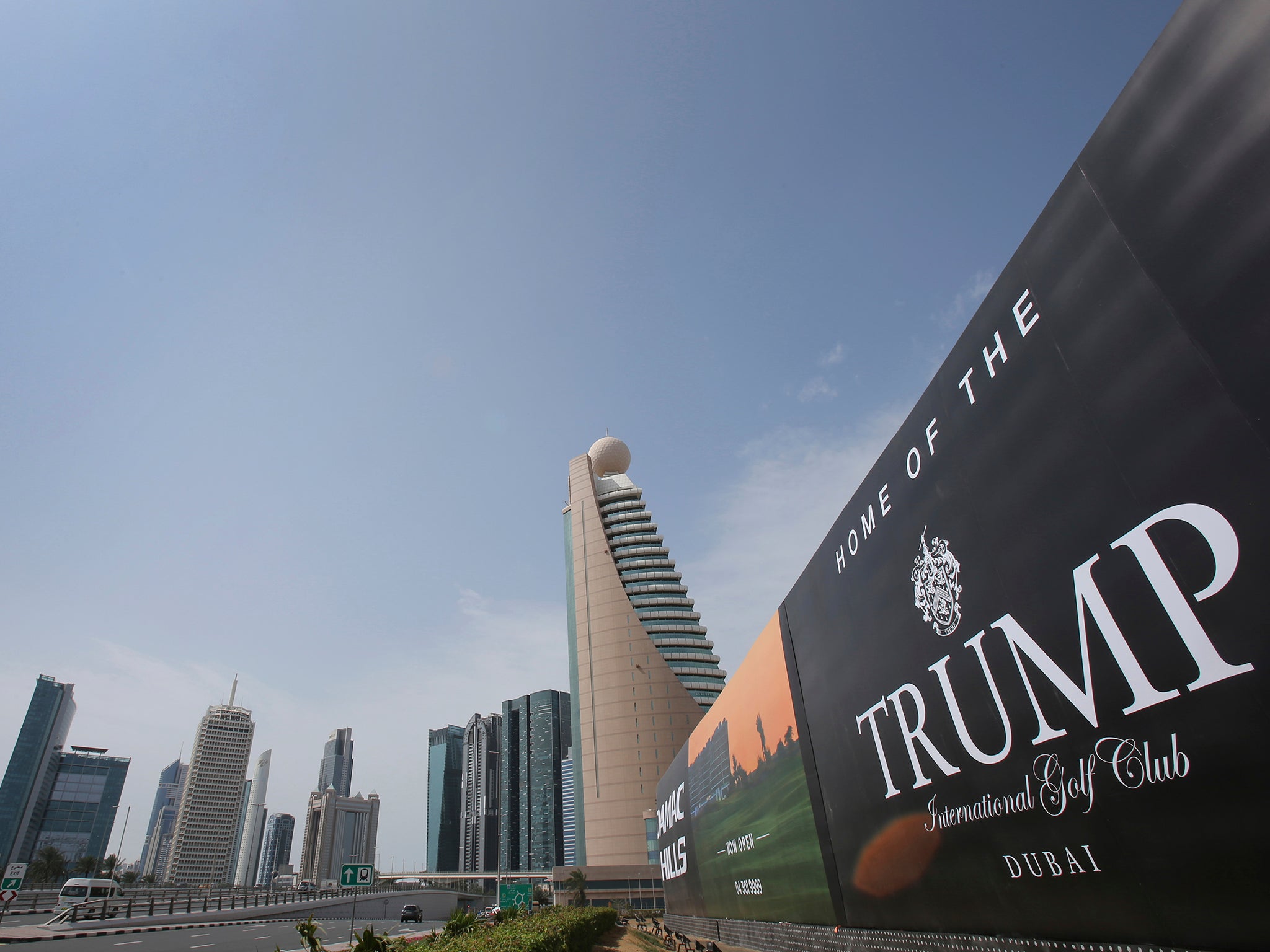 A giant billboard advertising the Trump International Golf Club hangs at the Dubai Trade Center roundabout, in Dubai.