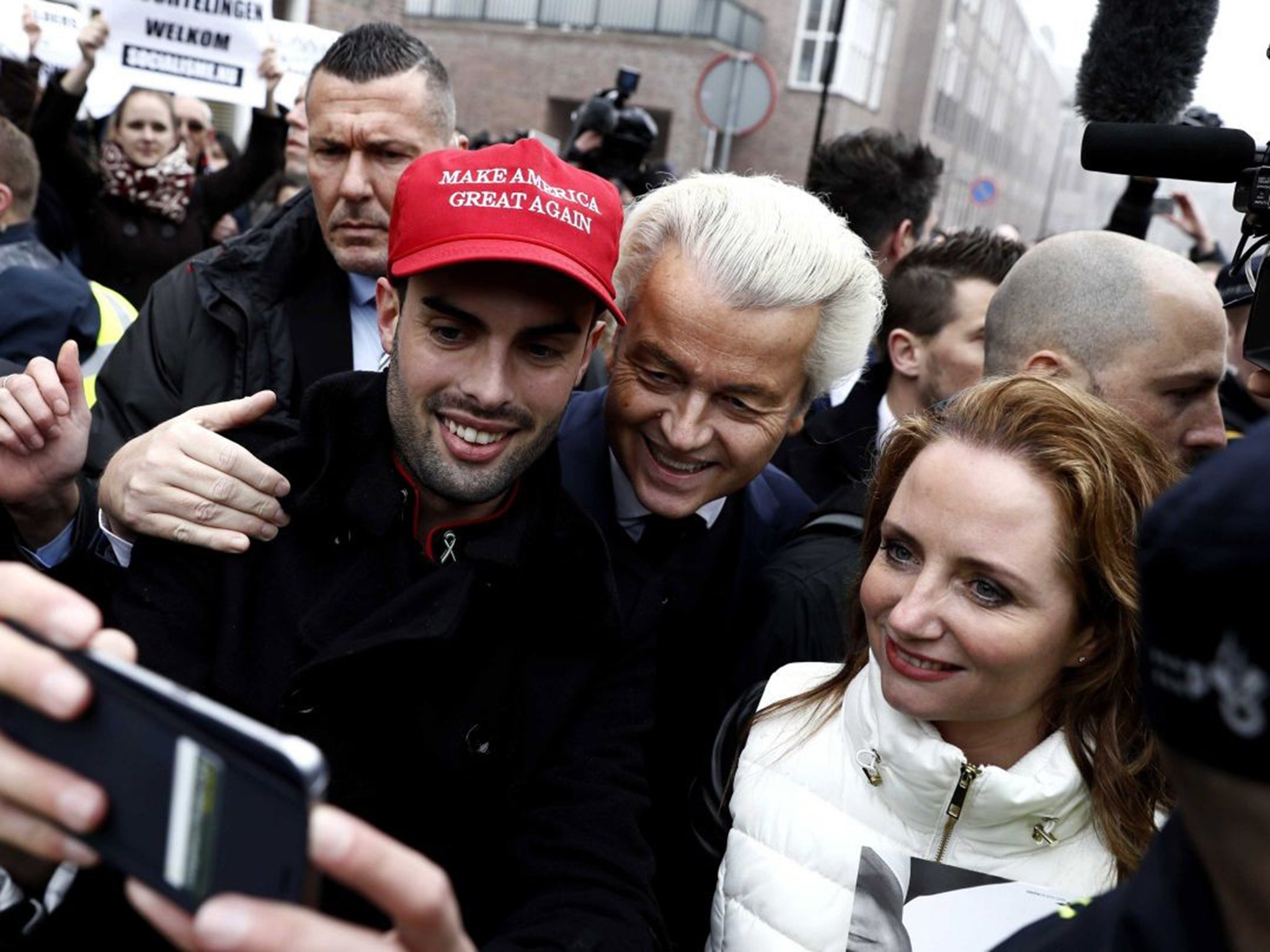 Dutch politician Geert Wilders with a supporter wearing a pro-Donald Trump hat in Spijkenisse