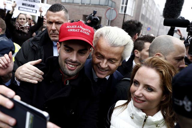 Dutch politician Geert Wilders with a supporter wearing a pro-Donald Trump hat in Spijkenisse