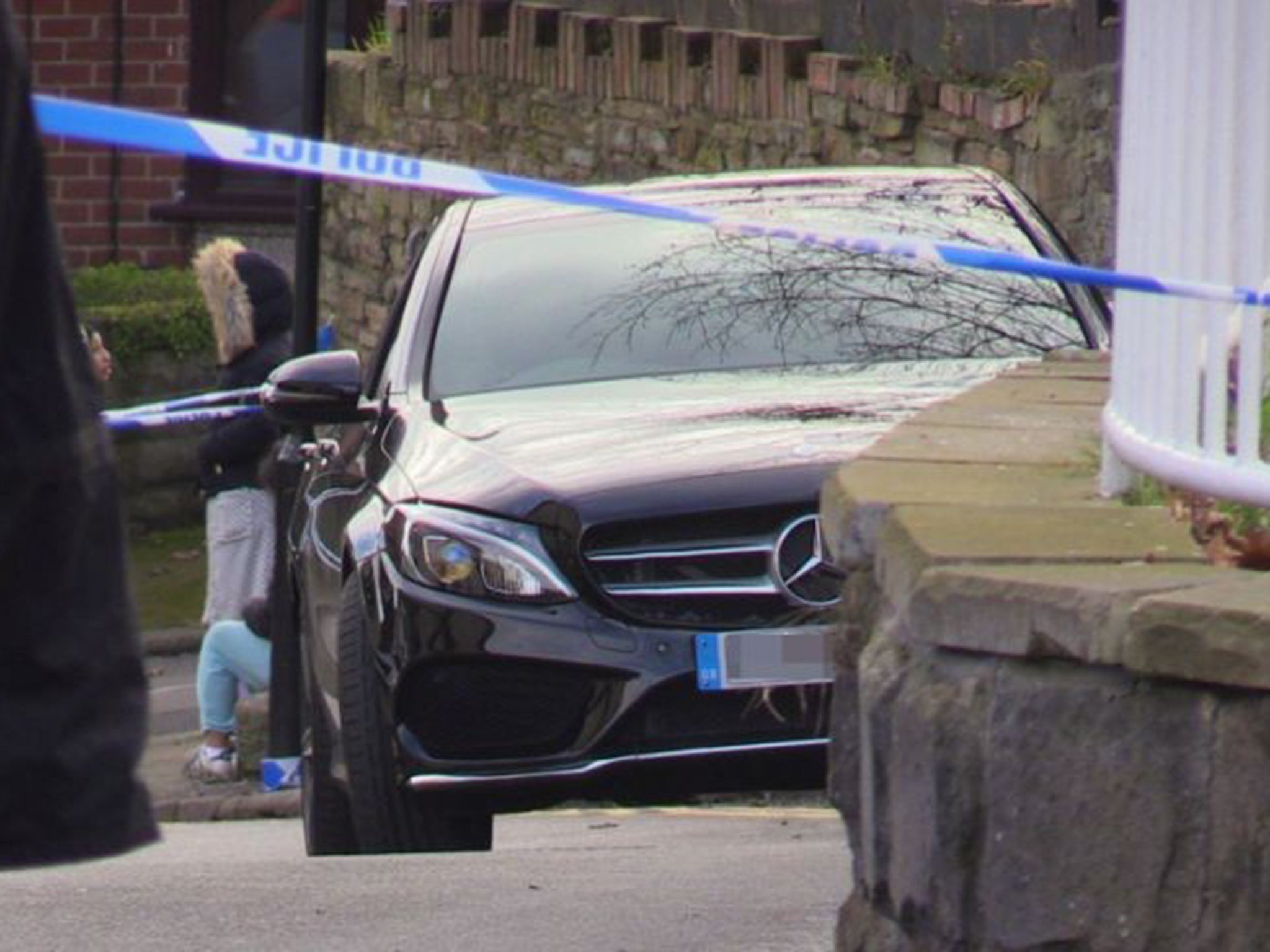 The black Mercedes where the man was shot